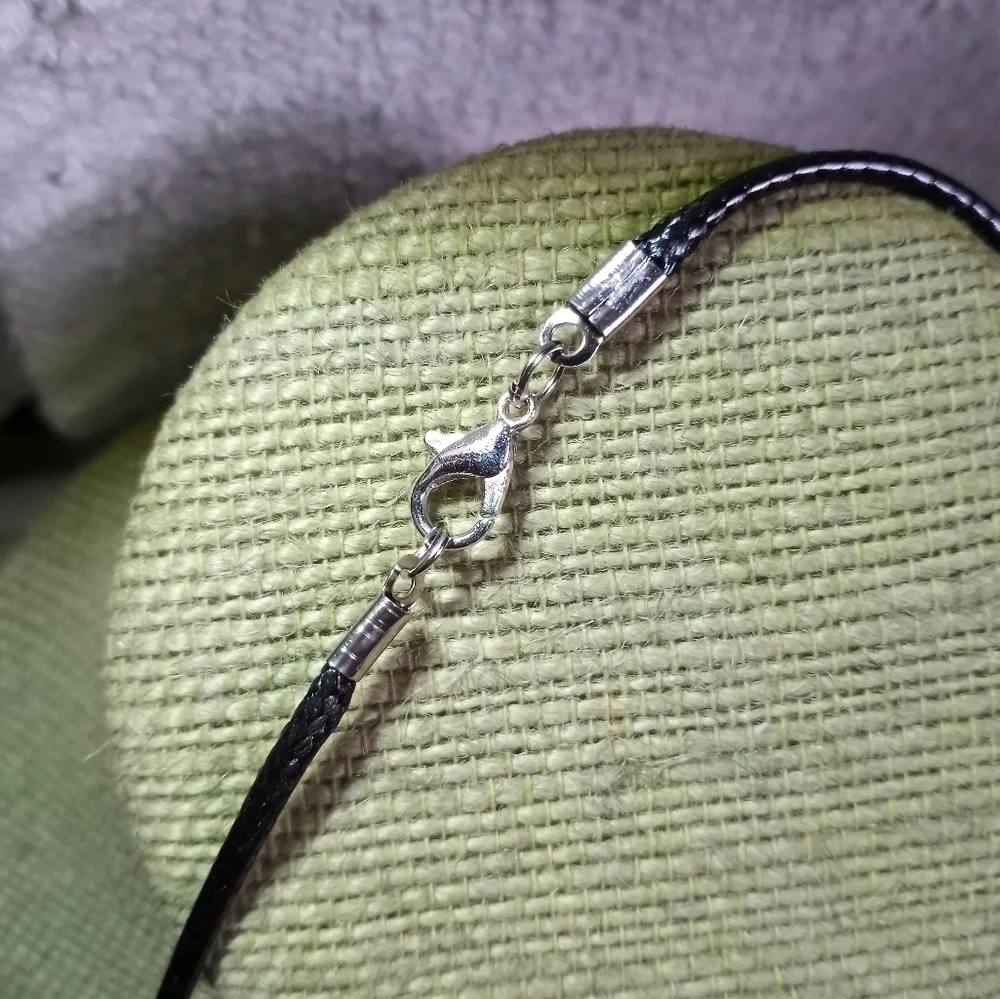Silvertone white owl on black cord with black eyes necklace